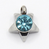 Colgante acero inoxidable estrella con cristal facetado color azul 9x8x3mm. Agujero 1,5mm