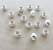 10 Unid. Bola Acero inoxidable 6x4,5mm. Agujero 2,9mm. Color plata brillante